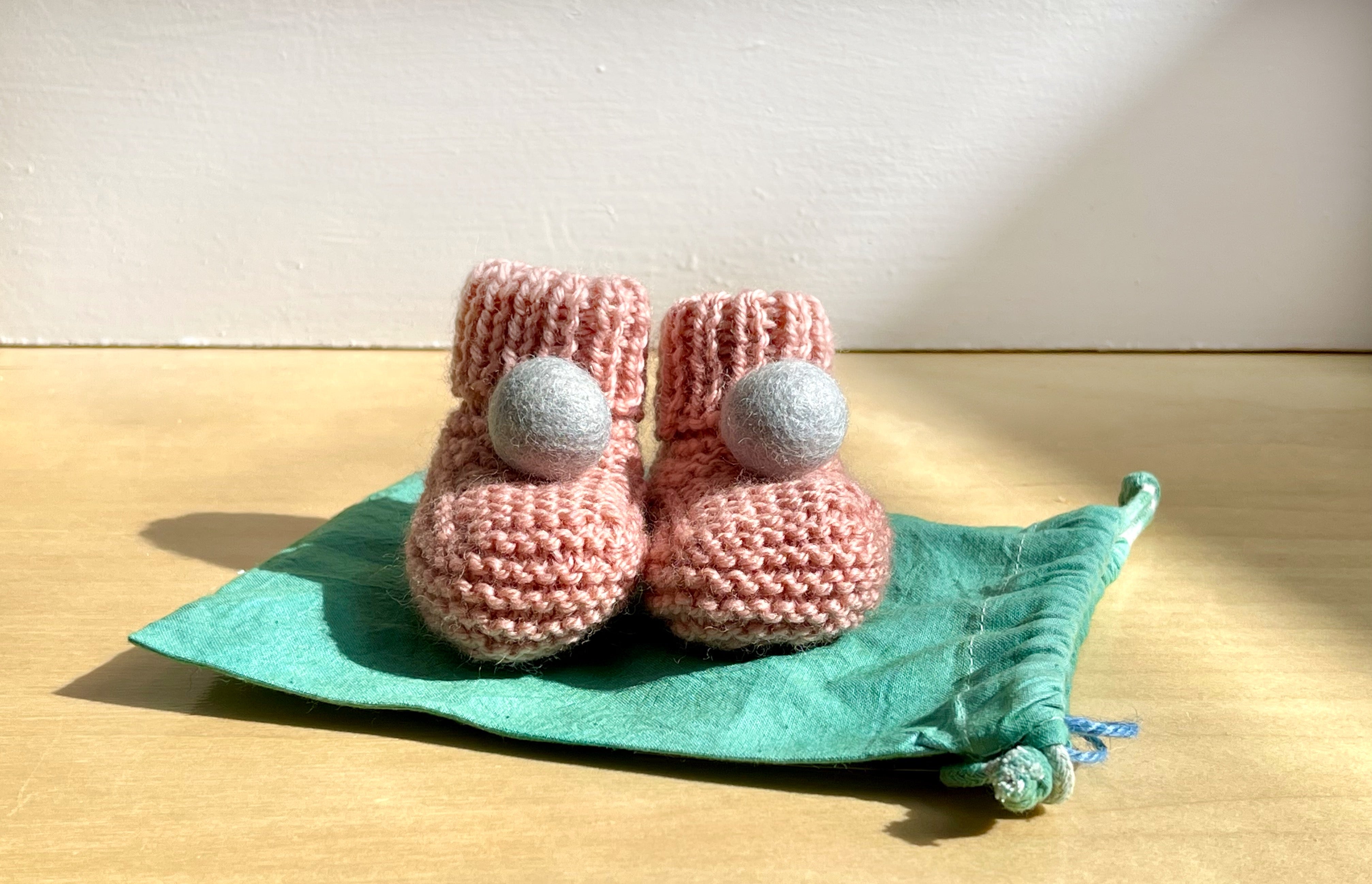 Pom pom hotsell baby booties